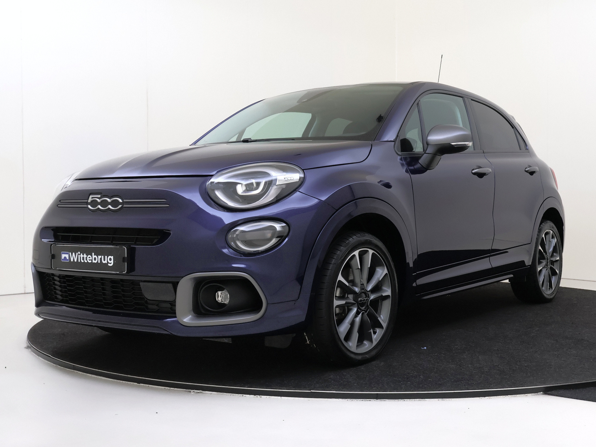 Fiat 500X 1.5 Hybrid Sport | Achteruitrijcamera | Keyless entry | Sportstuurwiel | Automatisch dimmende binnenspiegel | Lederen versnellingspook |